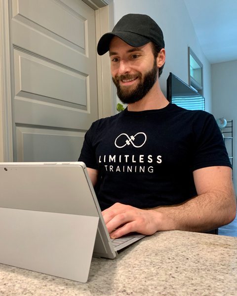 Coach Tyler at Computer in home physical therapy